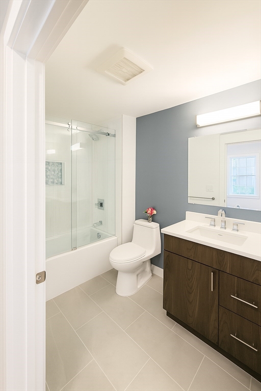 98 Prescott Street, Unit 2C Boston, MA 02128 - Photo 12 of 15 a bathroom with a double vanity sink mirror and toilet