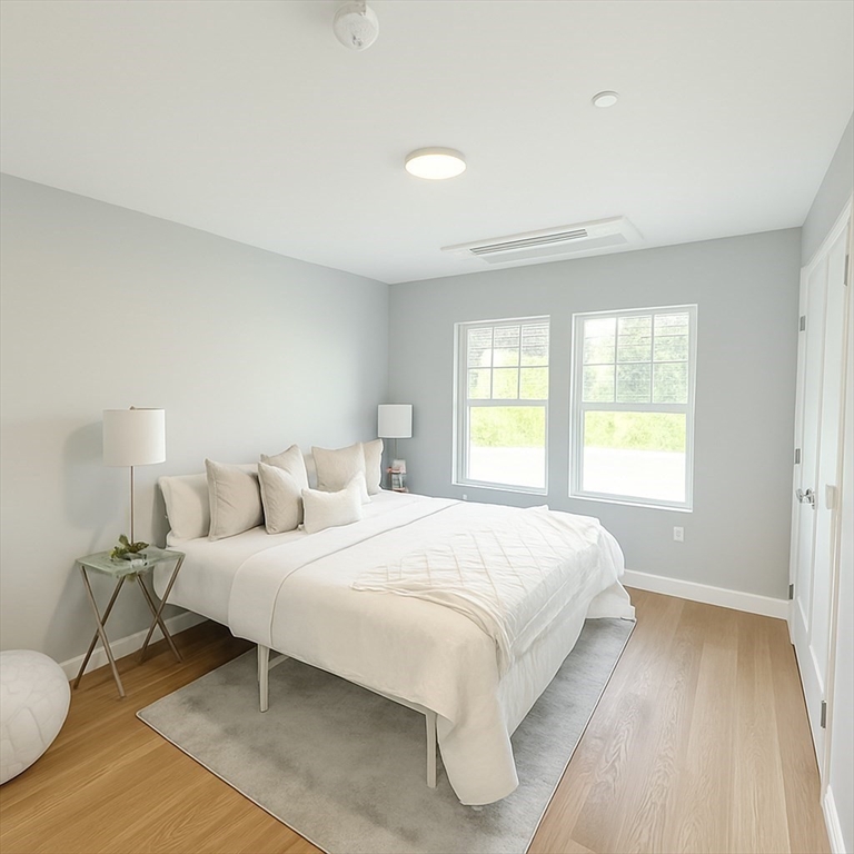 98 Prescott Street, Unit 2C Boston, MA 02128 - Photo 8 of 15 a bedroom with a bed and a window
