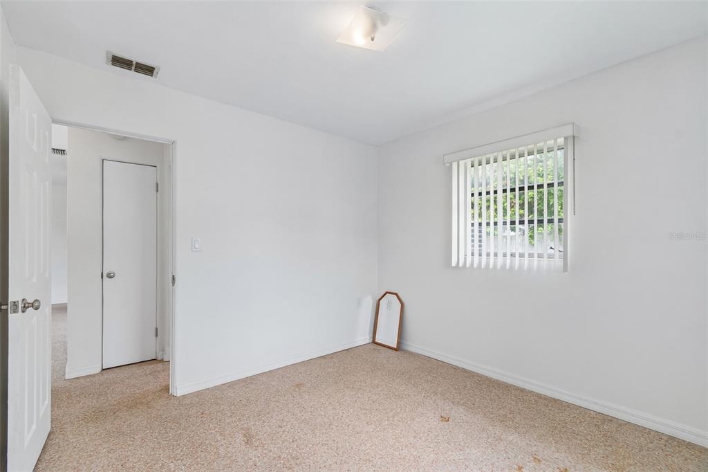 6634 Manor Beach Road New Port Richey, FL 34652 - Photo 32 of 64 an empty room with windows
