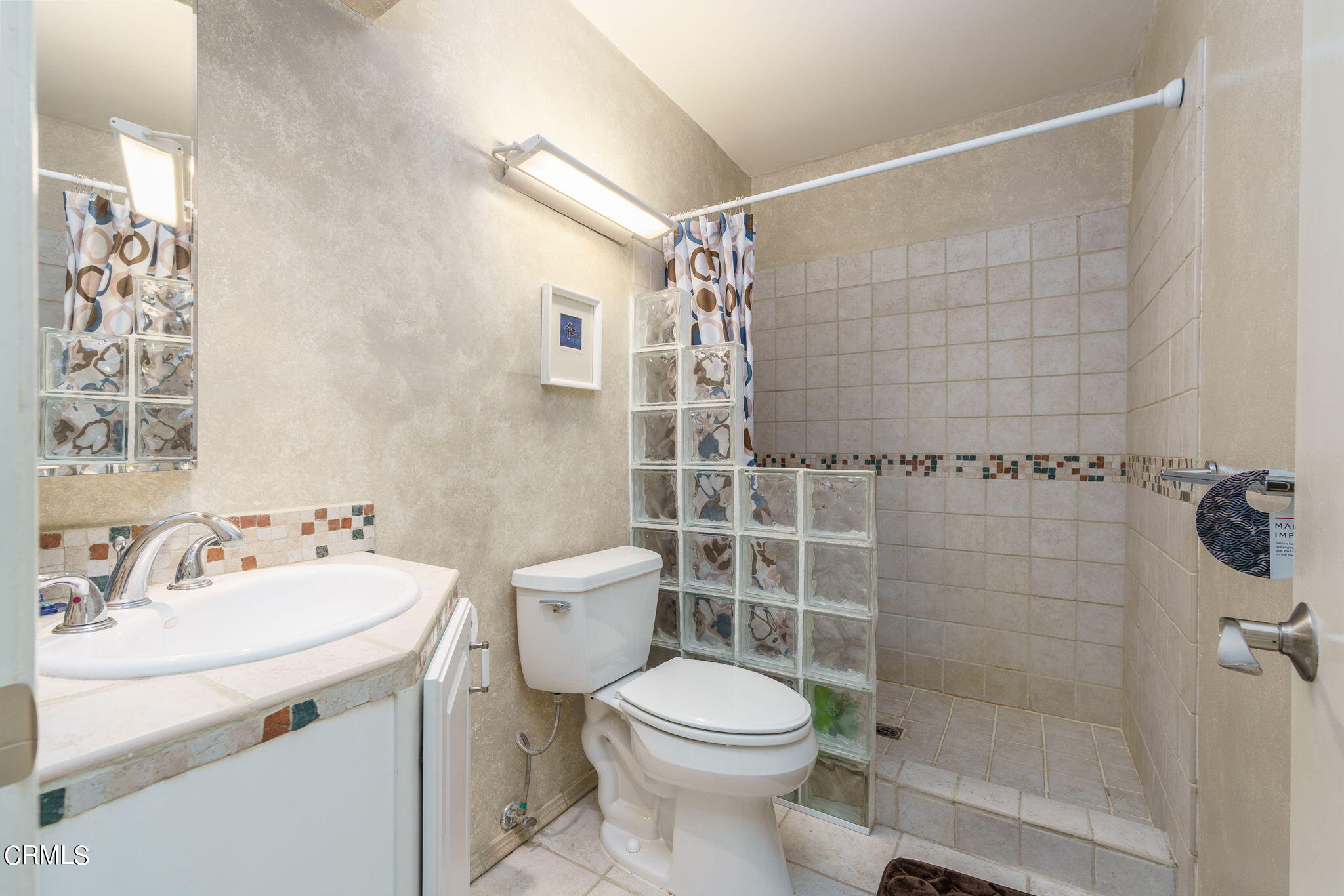 3225 Harbor Boulevard Oxnard, CA 93035 - Photo 18 of 34 a bathroom with a sink toilet and shower