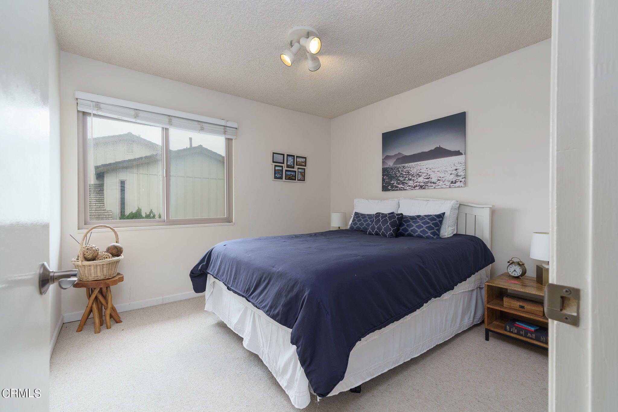 3225 Harbor Boulevard Oxnard, CA 93035 - Photo 19 of 34 a bedroom with a bed and a mirror