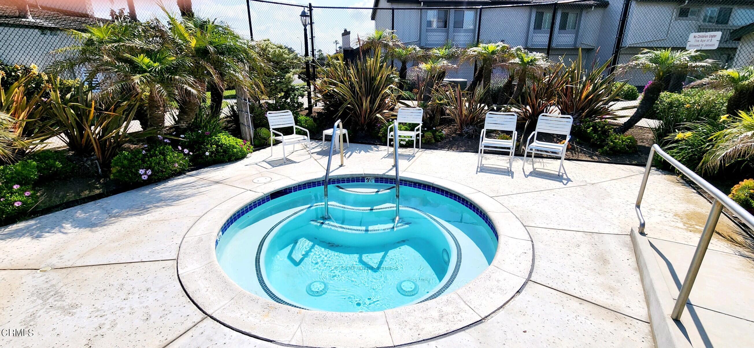 3225 Harbor Boulevard Oxnard, CA 93035 - Photo 26 of 34 a backyard of a house with table and chairs