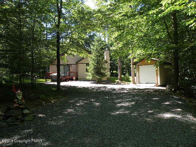 283 Elk Run Road Pocono Lake, PA 18347 - Photo 27 of 31 a backyard of a house with lots of green space and fountain