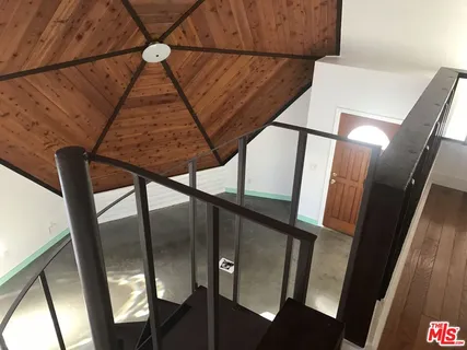 a view of an empty room and a window