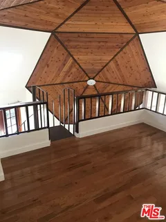 a view of a room with windows and yard