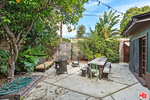a outdoor living space with furniture and garden view
