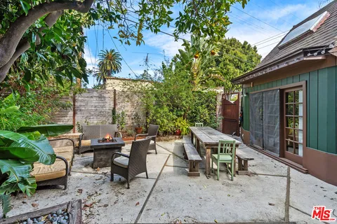 a outdoor space with furniture and umbrella