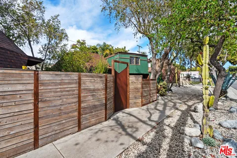 a view of a backyard of the house