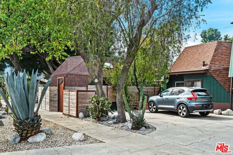 a car parked in front of a house