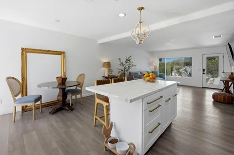 a view of kitchen with dining table and chairs
