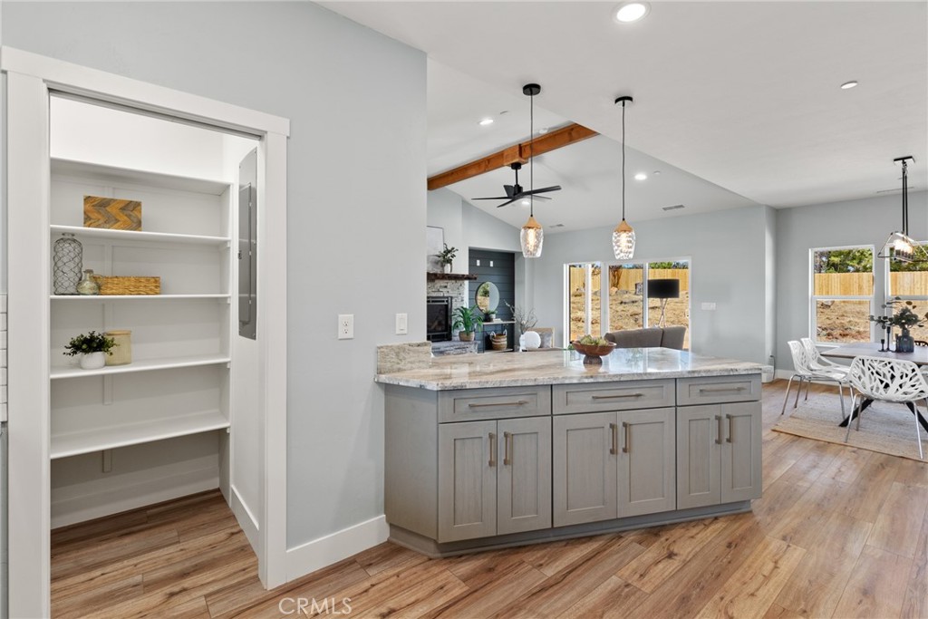 574 Hillcrest Drive Paradise, CA 95969 - Photo 9 of 26 a kitchen with a stove cabinets and wooden floor