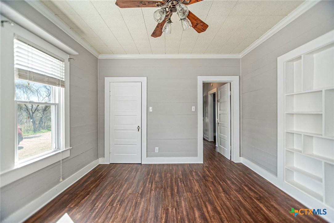 303 Garcitas Grove Road Inez, TX 77968 - Photo 20 of 39 a view of empty room with wooden floor and fan