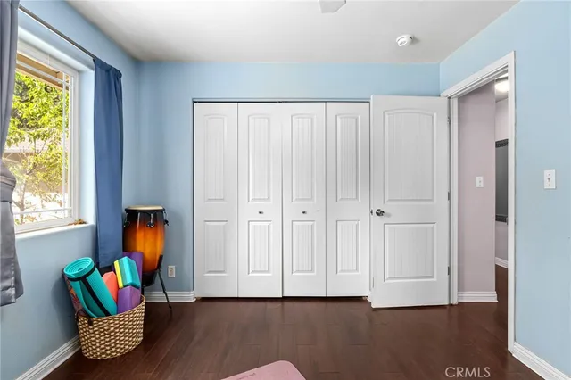 a view of room with furniture and wooden floor