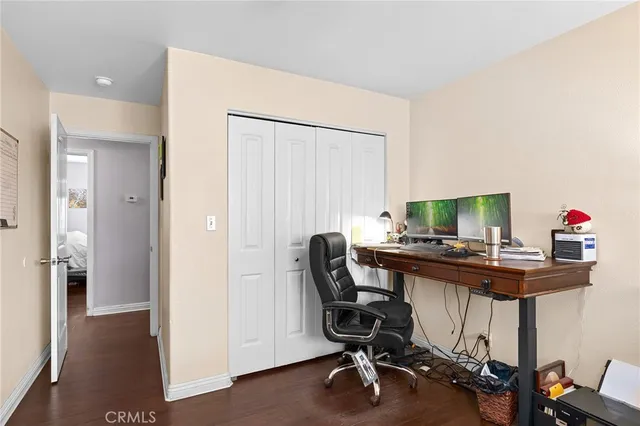 a bathroom with a sink a toilet a mirror a vanity and shower