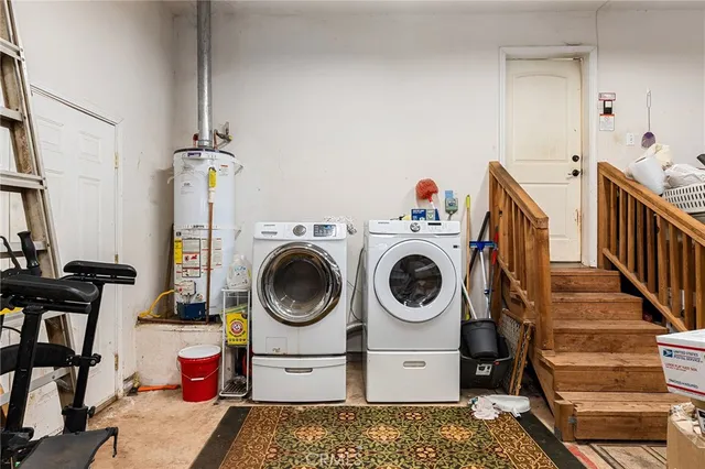 a view of a patio with couches chairs potted plants and floor to ceiling window