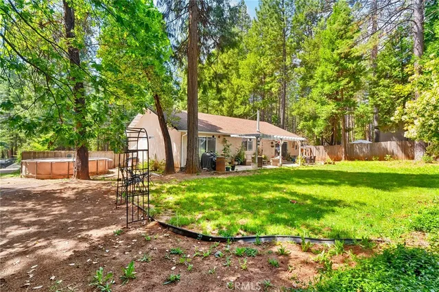 a view of a house with a yard porch and sitting area
