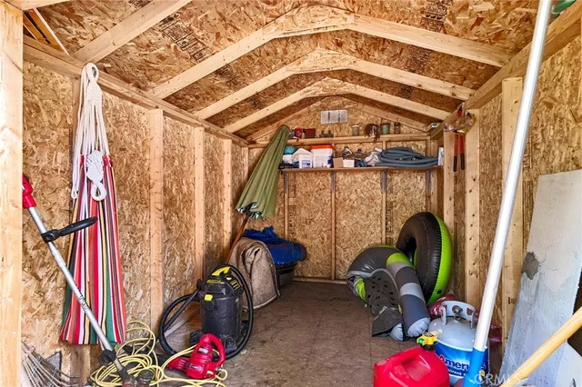 a sign that is in front of flowers