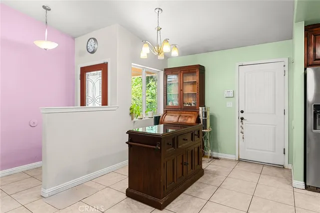 a kitchen with stainless steel appliances granite countertop a stove a refrigerator and a cabinets