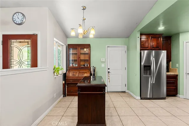 a view of a storage & utility room with closet window