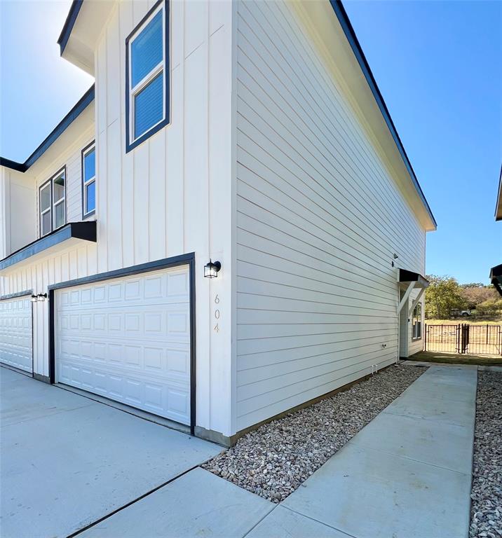 3501 East Renfro Street, Unit 604 Burleson, TX 76028 - Photo 2 of 35 a view of a garage