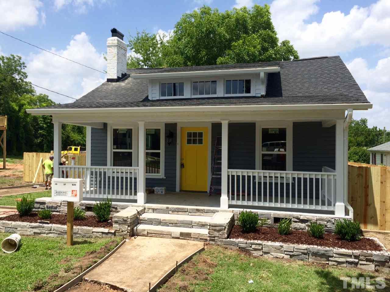 401 Bledsoe Avenue Raleigh, NC 27601 - Photo 1 of 5 a front view of a house with a yard