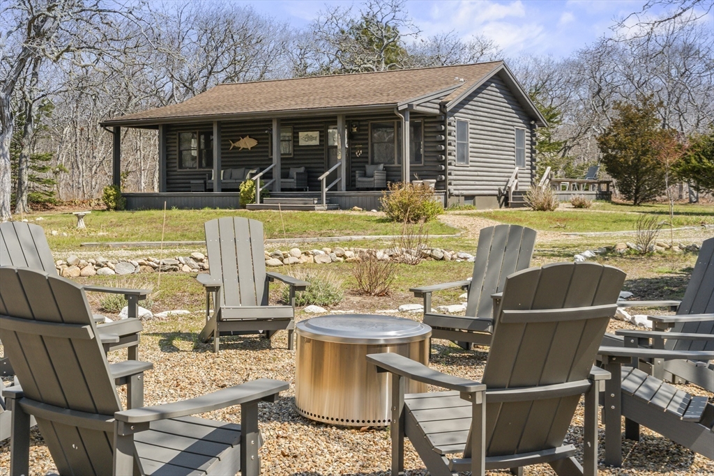 7 Pip'n Road Edgartown, MA 02539 - Photo 24 of 41 a view of a patio with table and chairs and potted plants