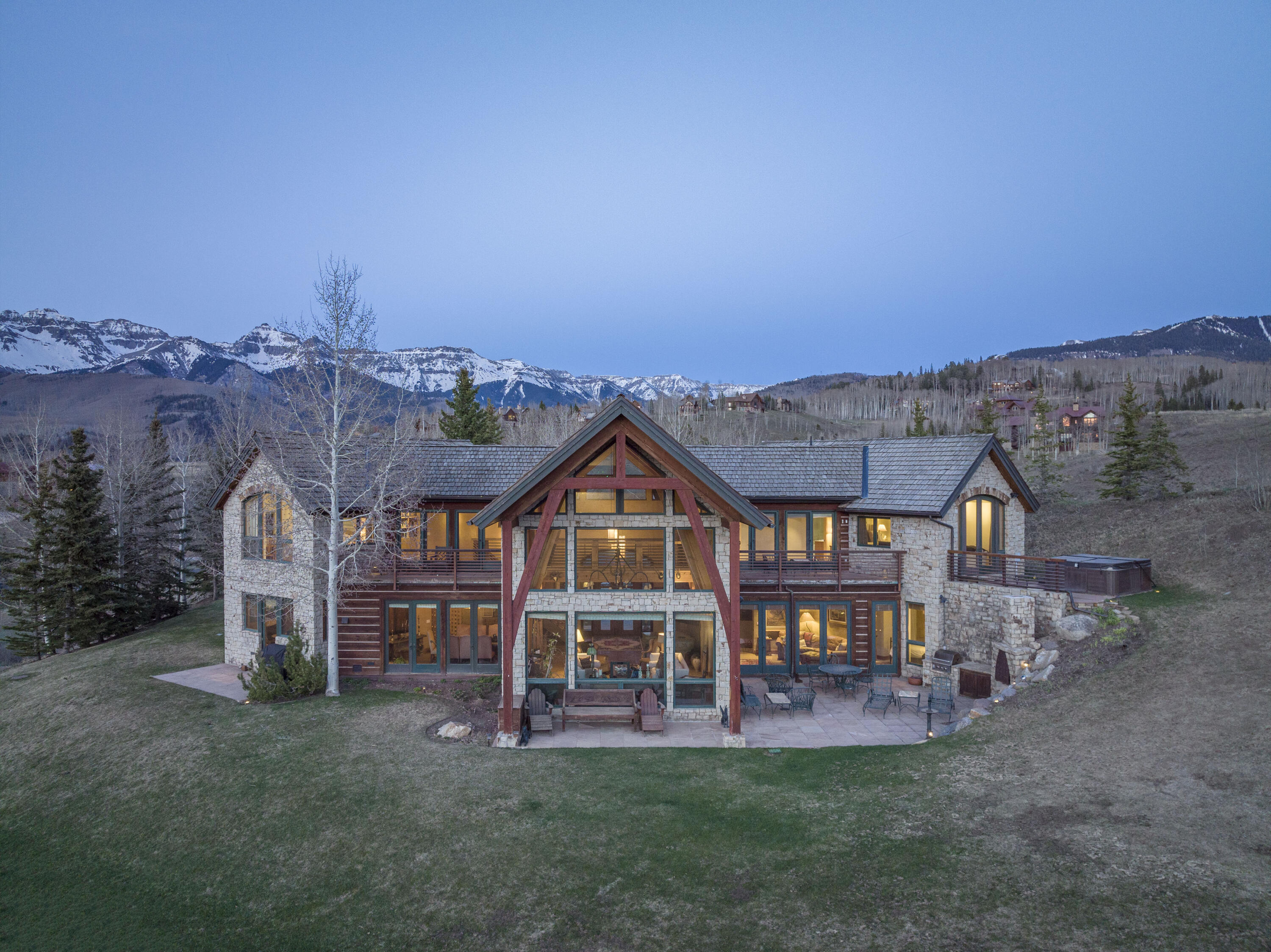151 Adams Ranch Road Mountain Village, CO 81435 - Photo 2 of 38 an aerial view of a house with a big yard and large trees