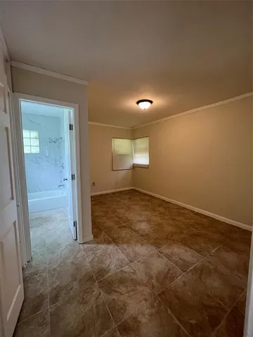 an empty room with a empty space and mirror