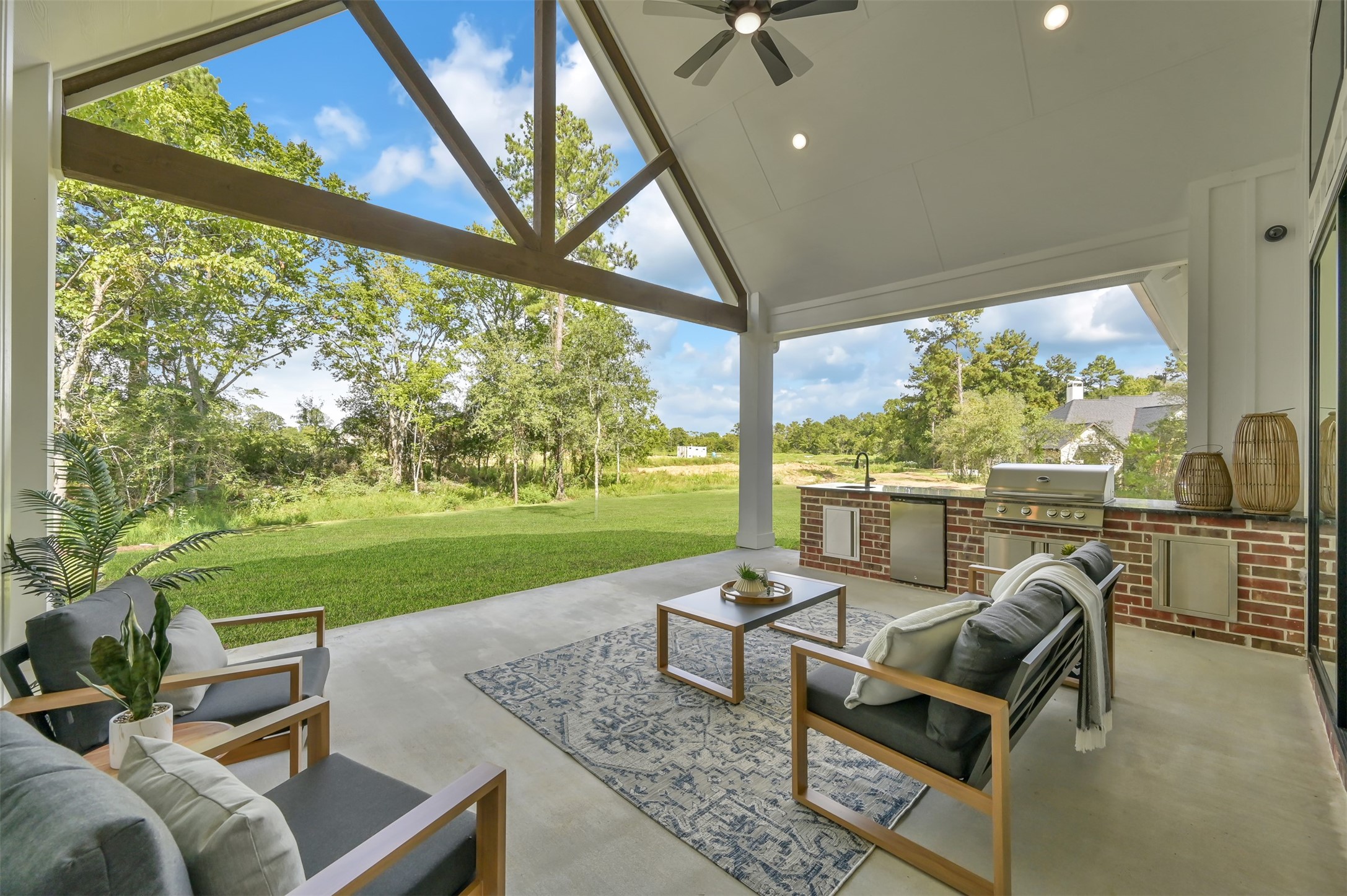 8557 Butler Rnch Court Plantersville, TX 77363 - Photo 37 of 39 Summer kitchen under the oversized patio
