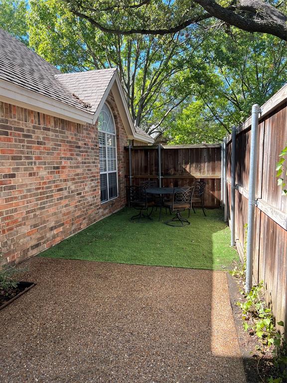 14604 Hemingway Court Addison, TX 75001 - Photo 21 of 27 a view of backyard with potted plants and a large tree