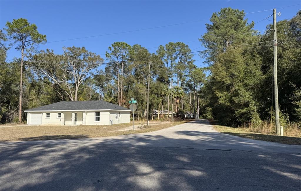 Sequoia Loop Track Ocklawaha, FL 32179 - Photo 7 of 7 a front view of a house with a yard and trees