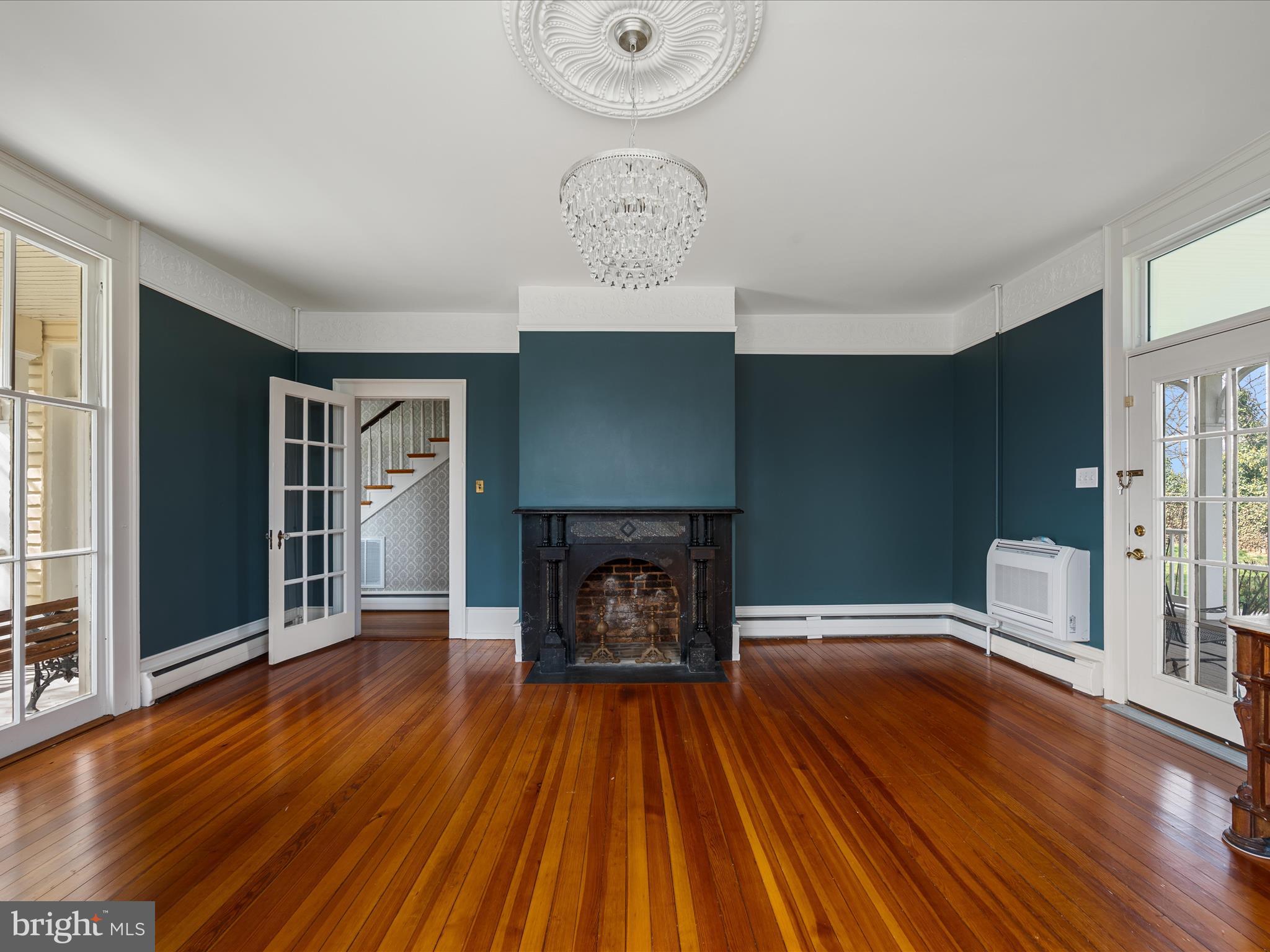 7919 Church Street Middletown, VA 22645 - Photo 17 of 48 wooden floor fireplace and windows in an empty room