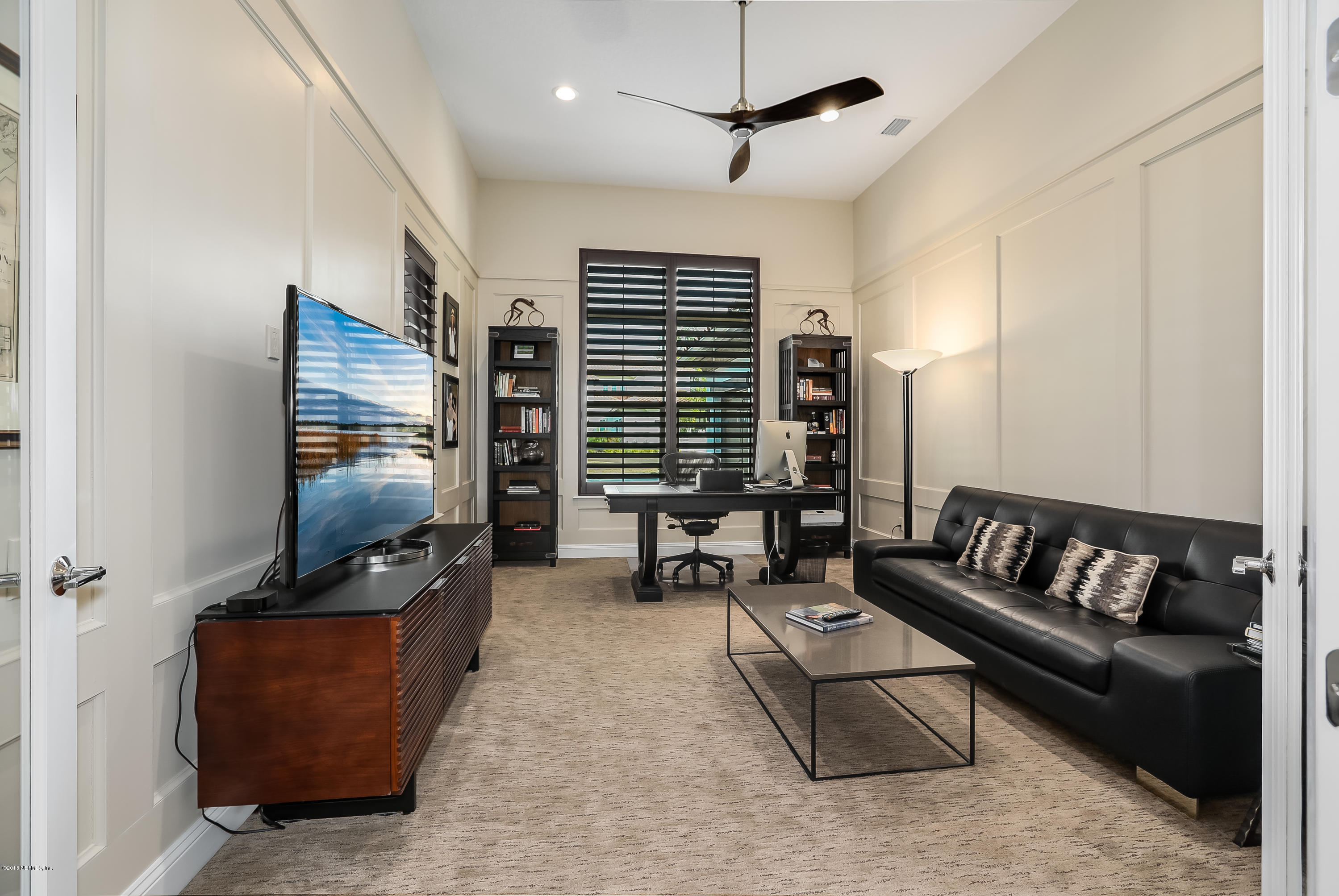 68 Costa Del Sol Drive St. Augustine, FL 32095 - Photo 13 of 55 a living room with furniture and a flat screen tv