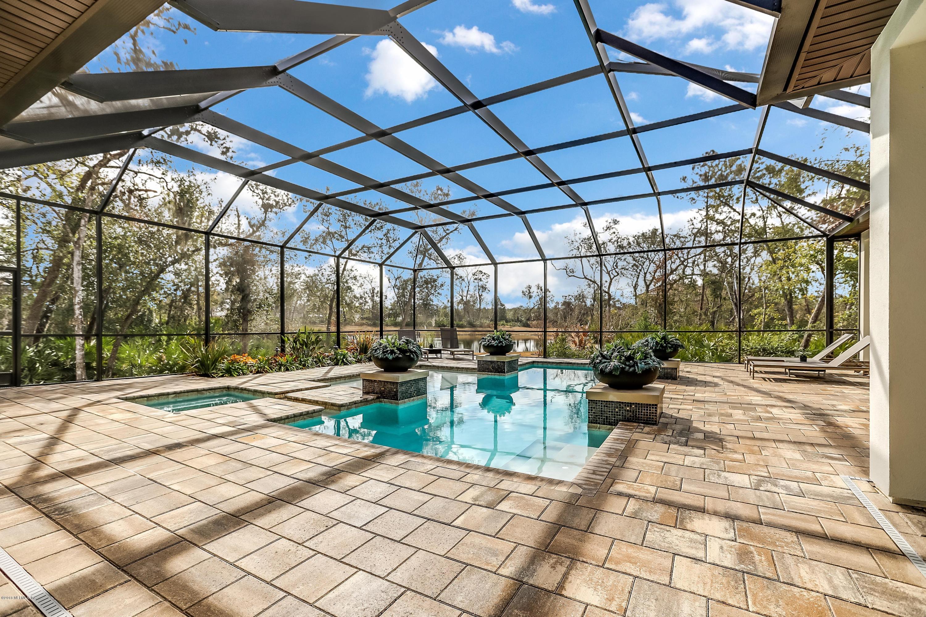 68 Costa Del Sol Drive St. Augustine, FL 32095 - Photo 15 of 55 a view of a patio with a dining table and chairs with wooden floor
