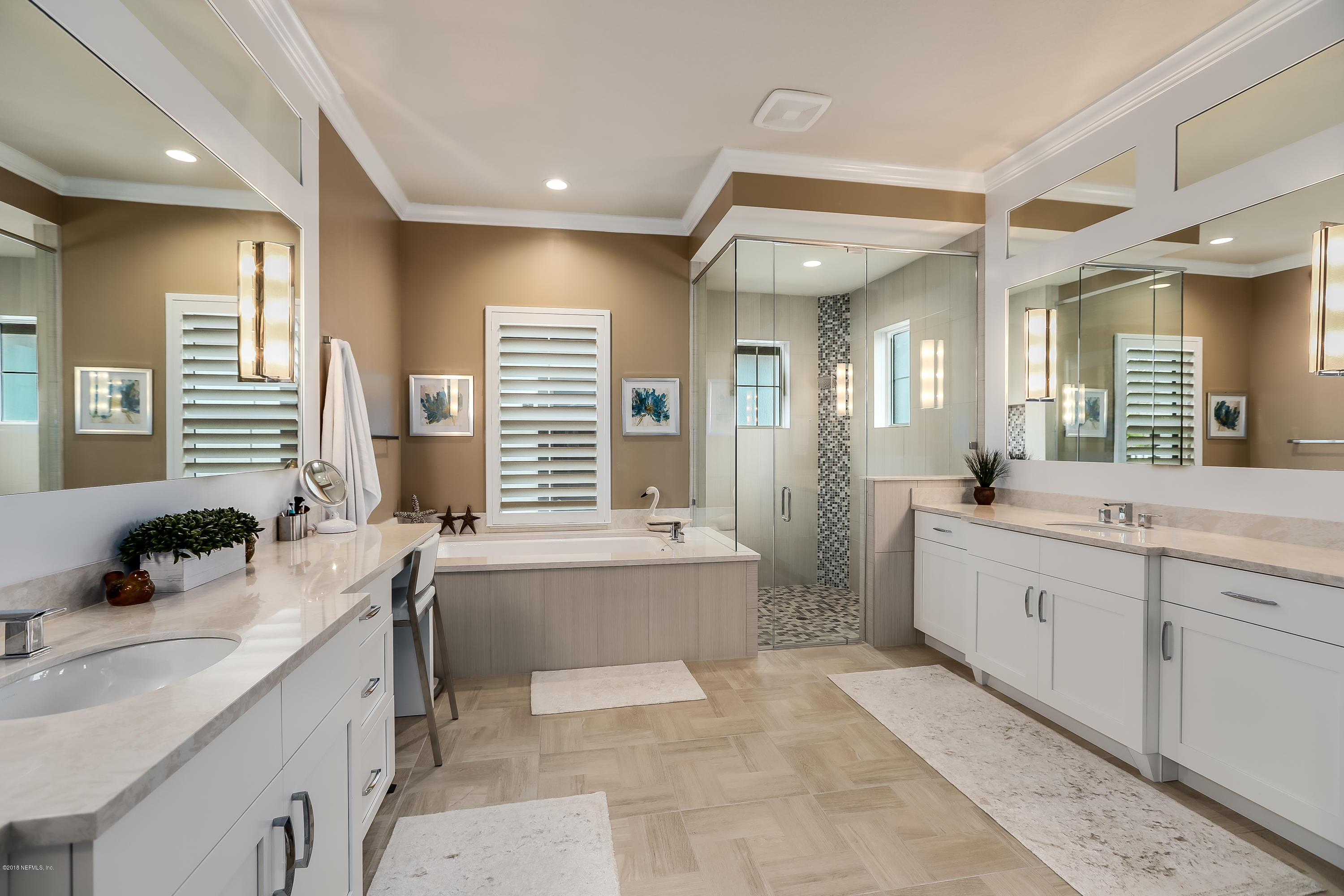 68 Costa Del Sol Drive St. Augustine, FL 32095 - Photo 20 of 55 a large bathroom with a granite countertop tub a double vanity sink a window and a mirror