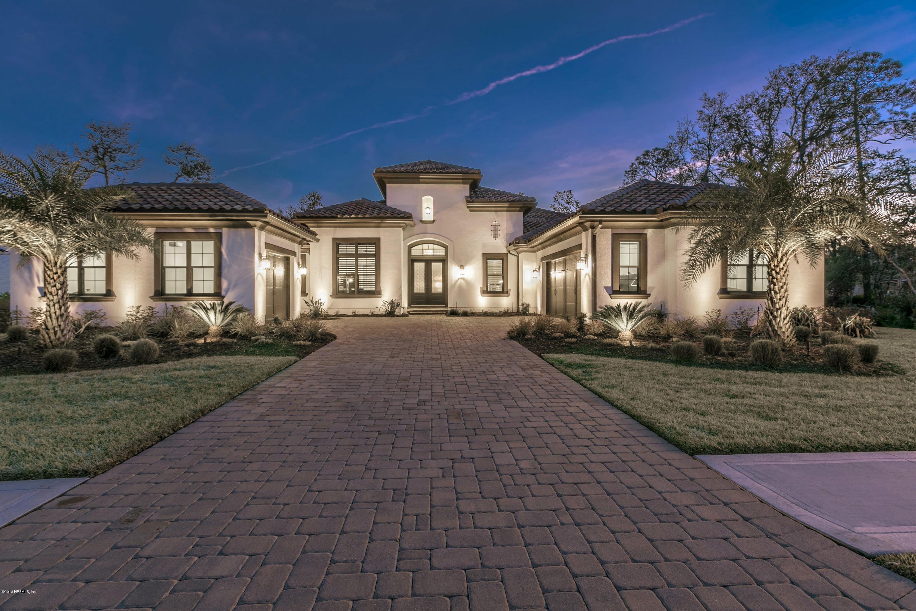 68 Costa Del Sol Drive St. Augustine, FL 32095 - Photo 2 of 55 a front view of a house with a yard and outdoor seating