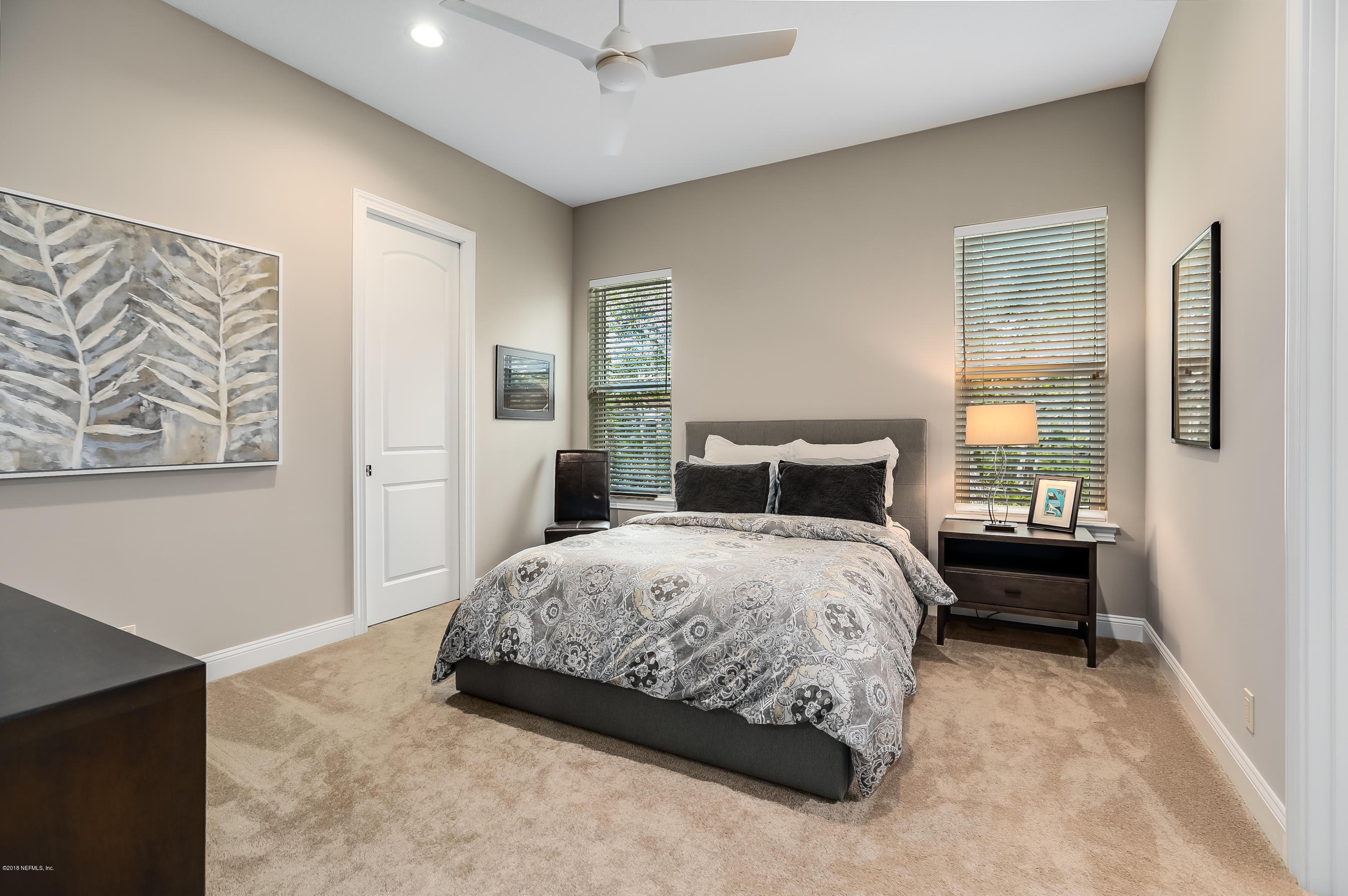 68 Costa Del Sol Drive St. Augustine, FL 32095 - Photo 21 of 55 a bedroom with a bed and a painting on the wall