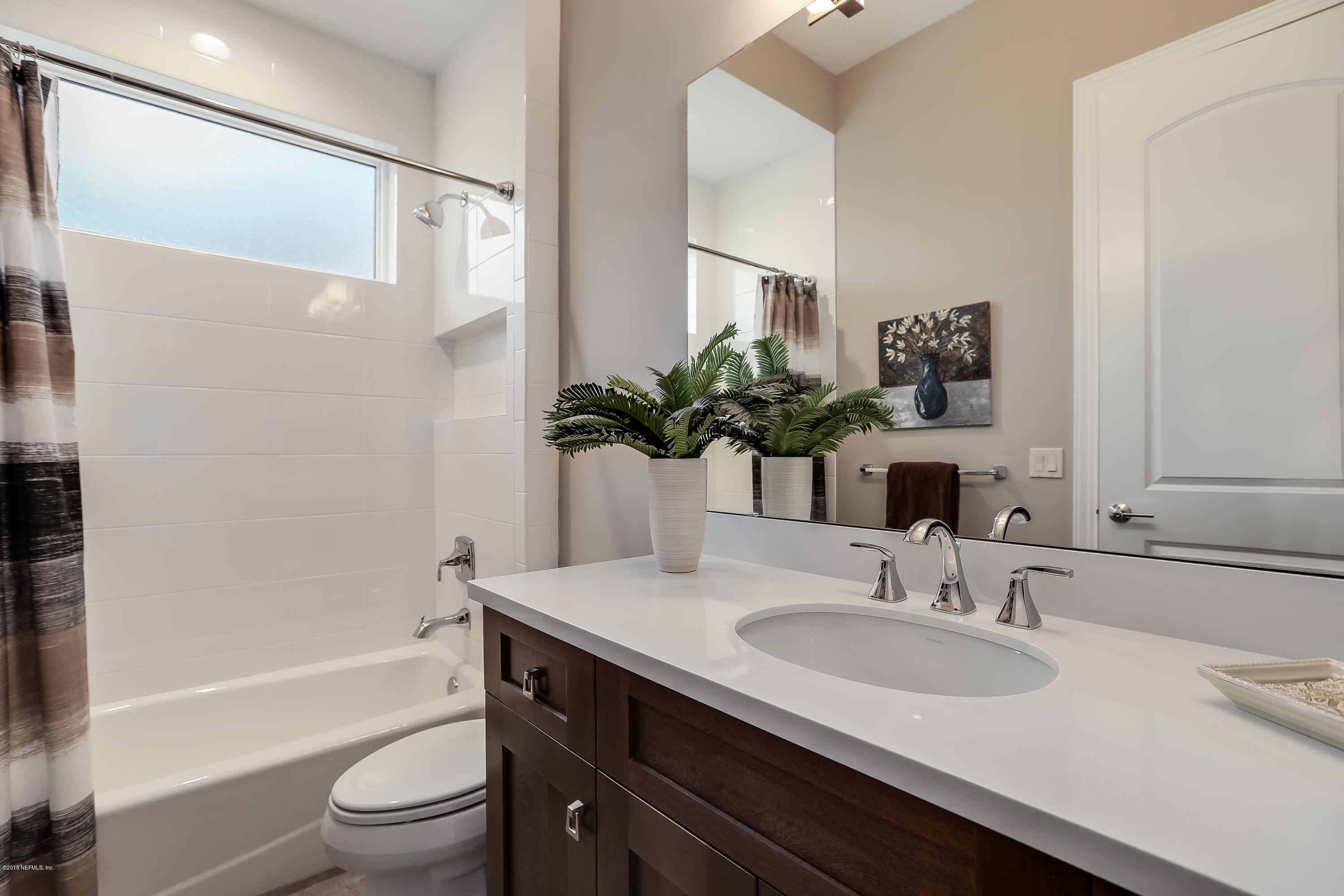 68 Costa Del Sol Drive St. Augustine, FL 32095 - Photo 22 of 55 a bathroom with a granite countertop sink toilet and shower