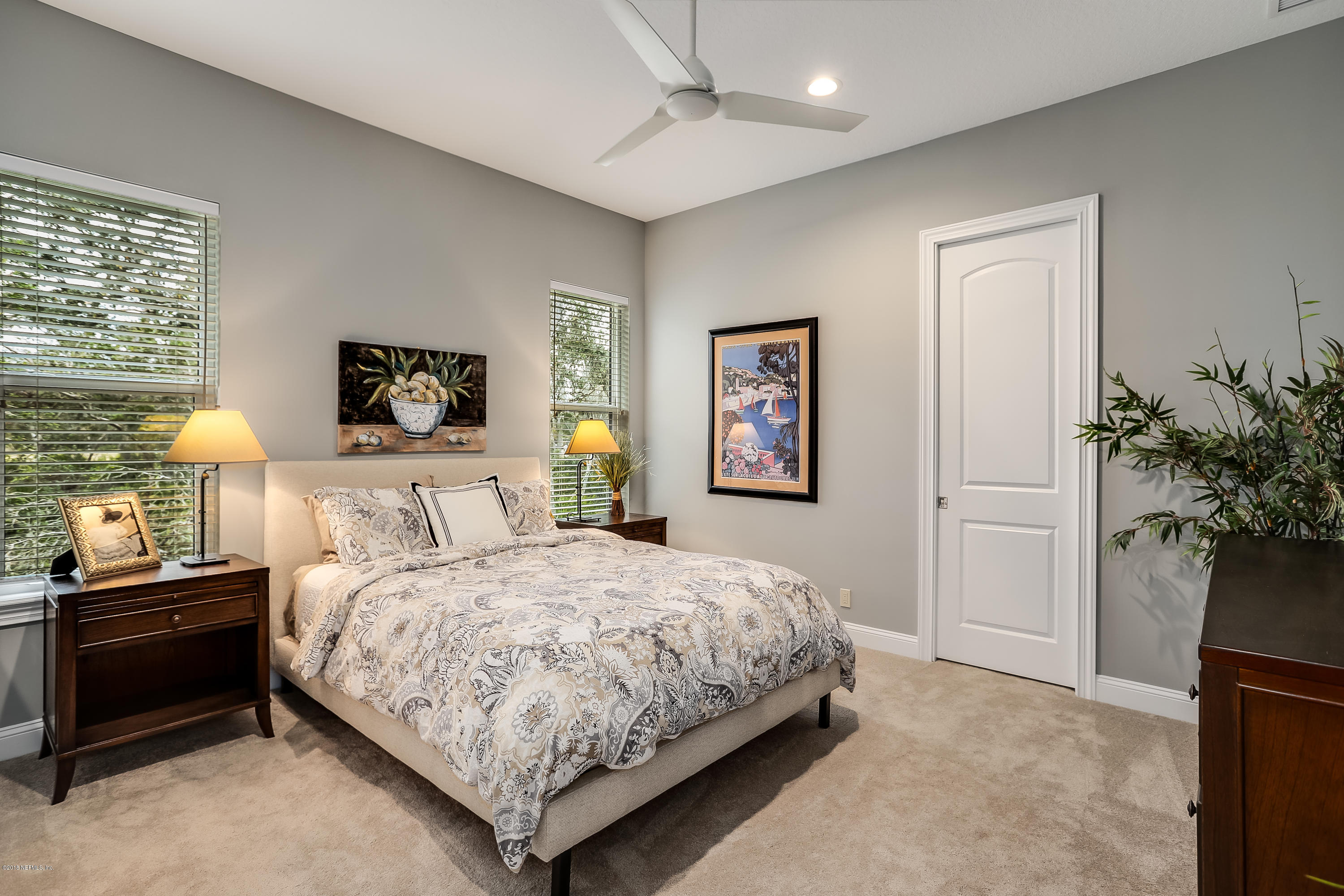 68 Costa Del Sol Drive St. Augustine, FL 32095 - Photo 26 of 55 a bedroom with a bed and a potted plant