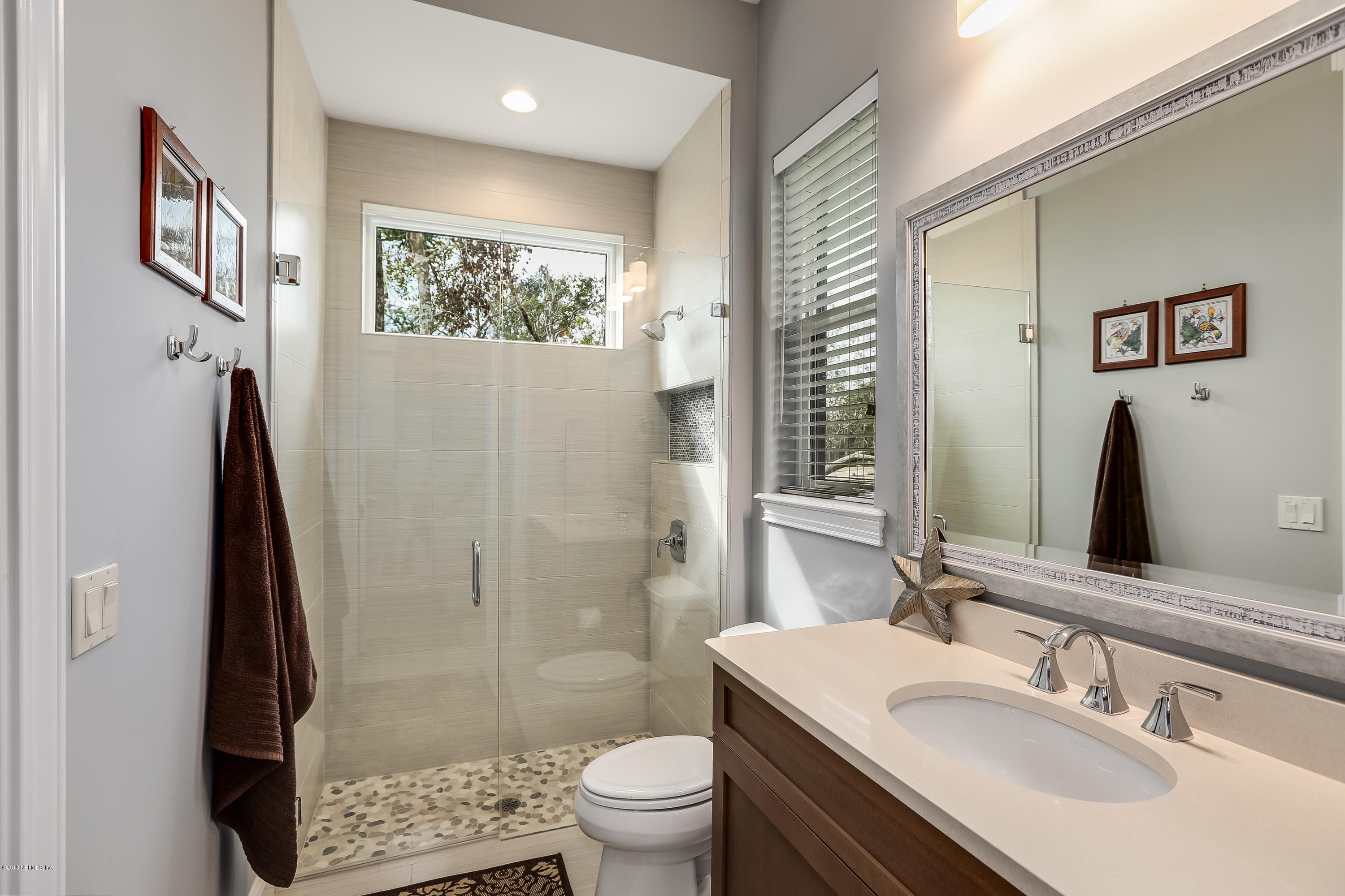 68 Costa Del Sol Drive St. Augustine, FL 32095 - Photo 29 of 55 a bathroom with a sink toilet and shower