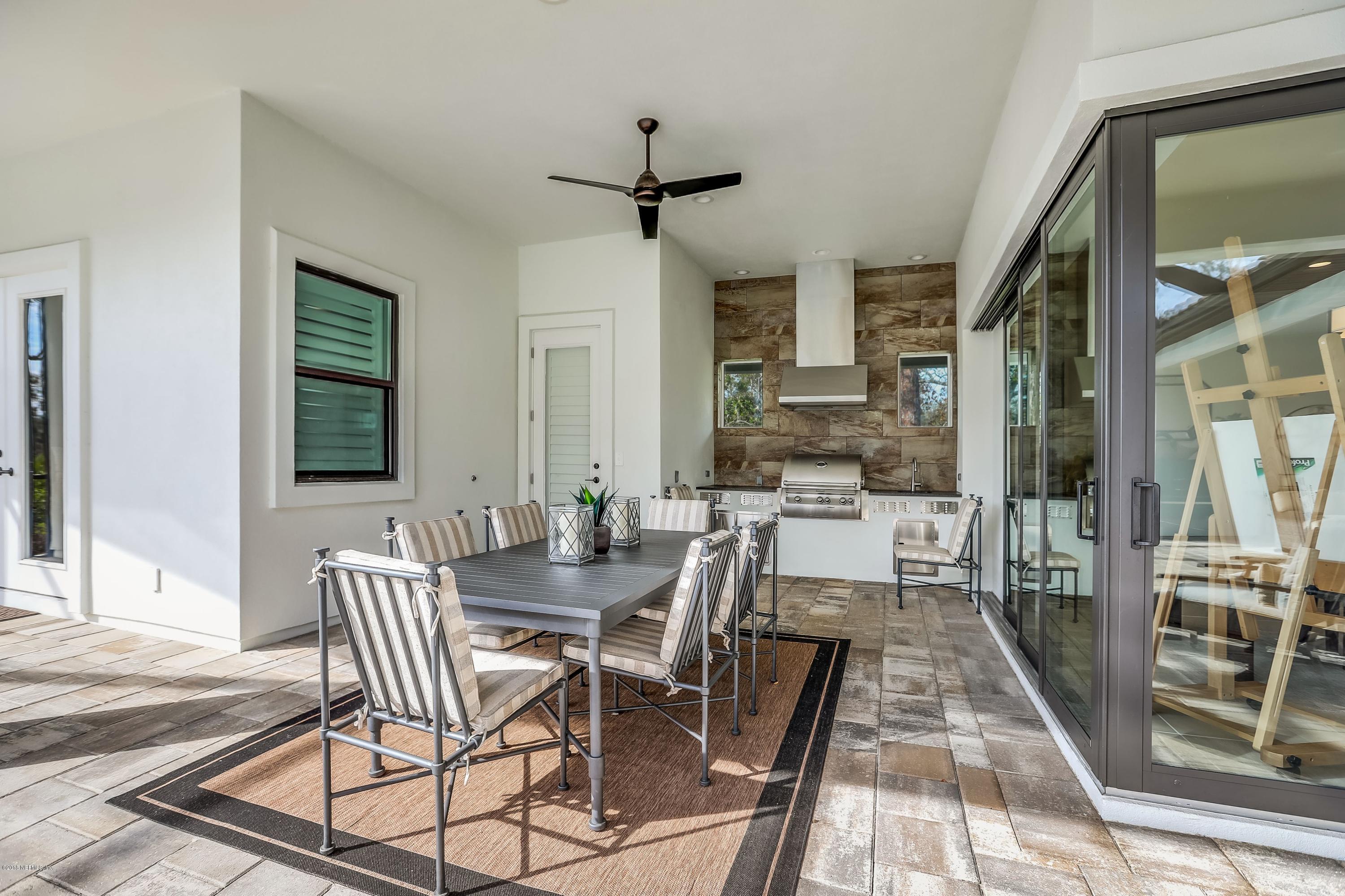 68 Costa Del Sol Drive St. Augustine, FL 32095 - Photo 30 of 55 a view of a dining room with furniture window and wooden floor