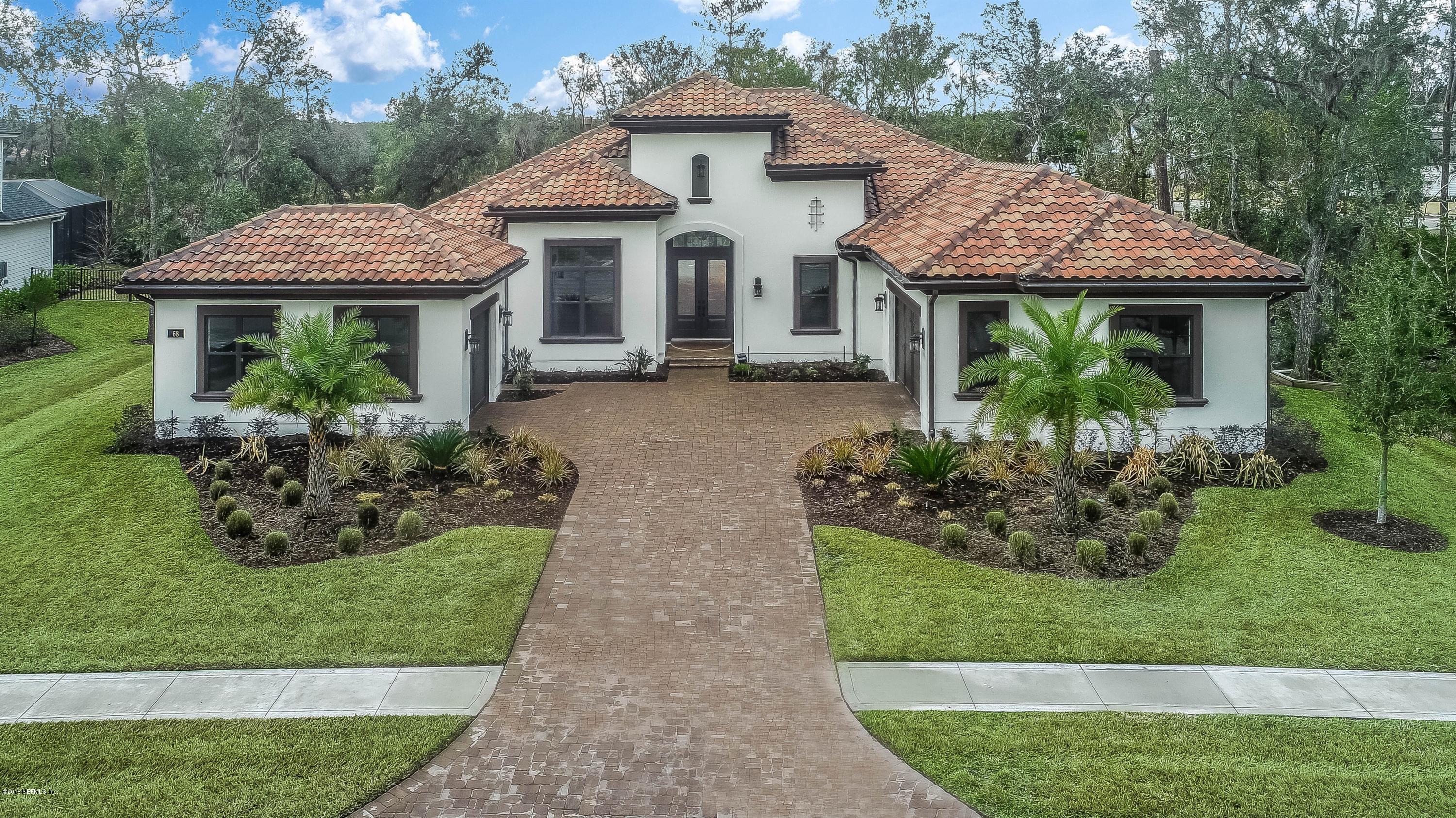 68 Costa Del Sol Drive St. Augustine, FL 32095 - Photo 3 of 55 a front view of a house with a yard