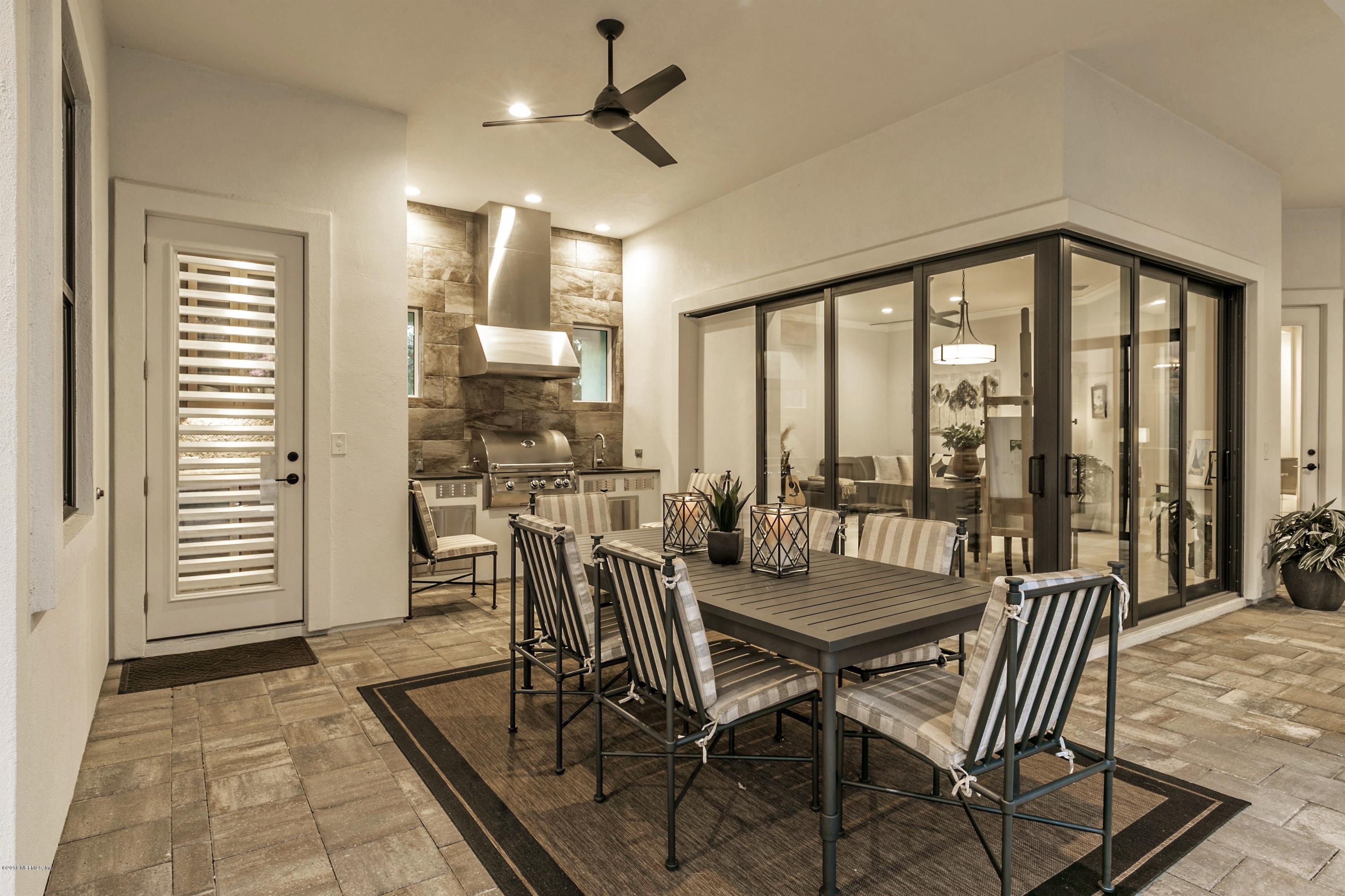 68 Costa Del Sol Drive St. Augustine, FL 32095 - Photo 31 of 55 a view of a dining room with furniture window and outside view