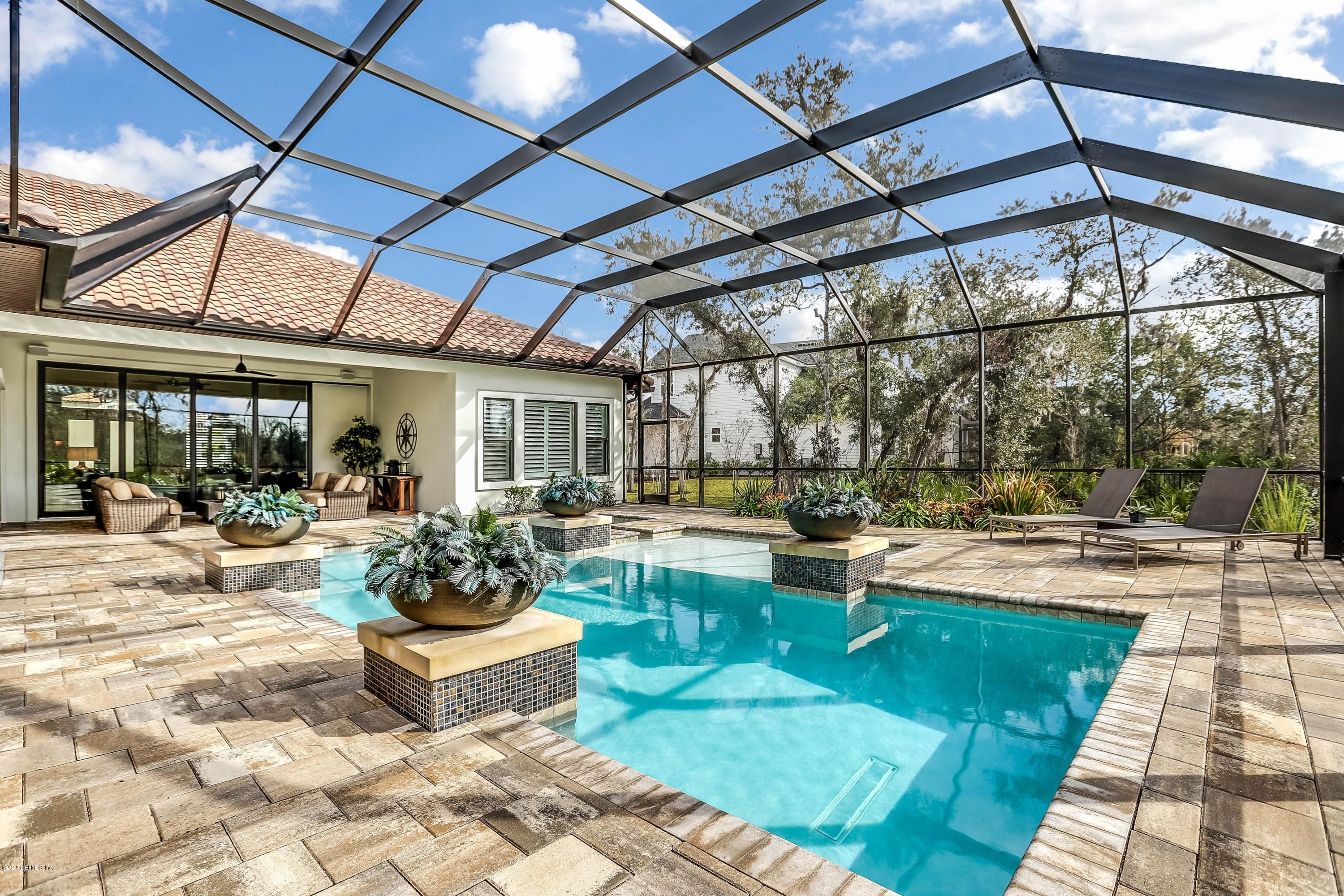68 Costa Del Sol Drive St. Augustine, FL 32095 - Photo 32 of 55 a view of a backyard with sitting area
