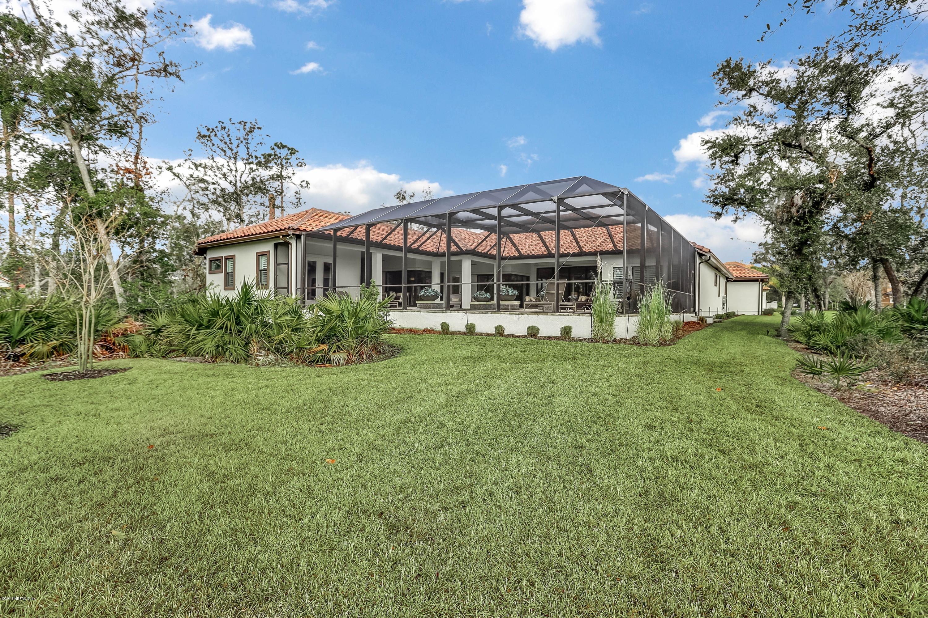 68 Costa Del Sol Drive St. Augustine, FL 32095 - Photo 35 of 55 a front view of a house with garden