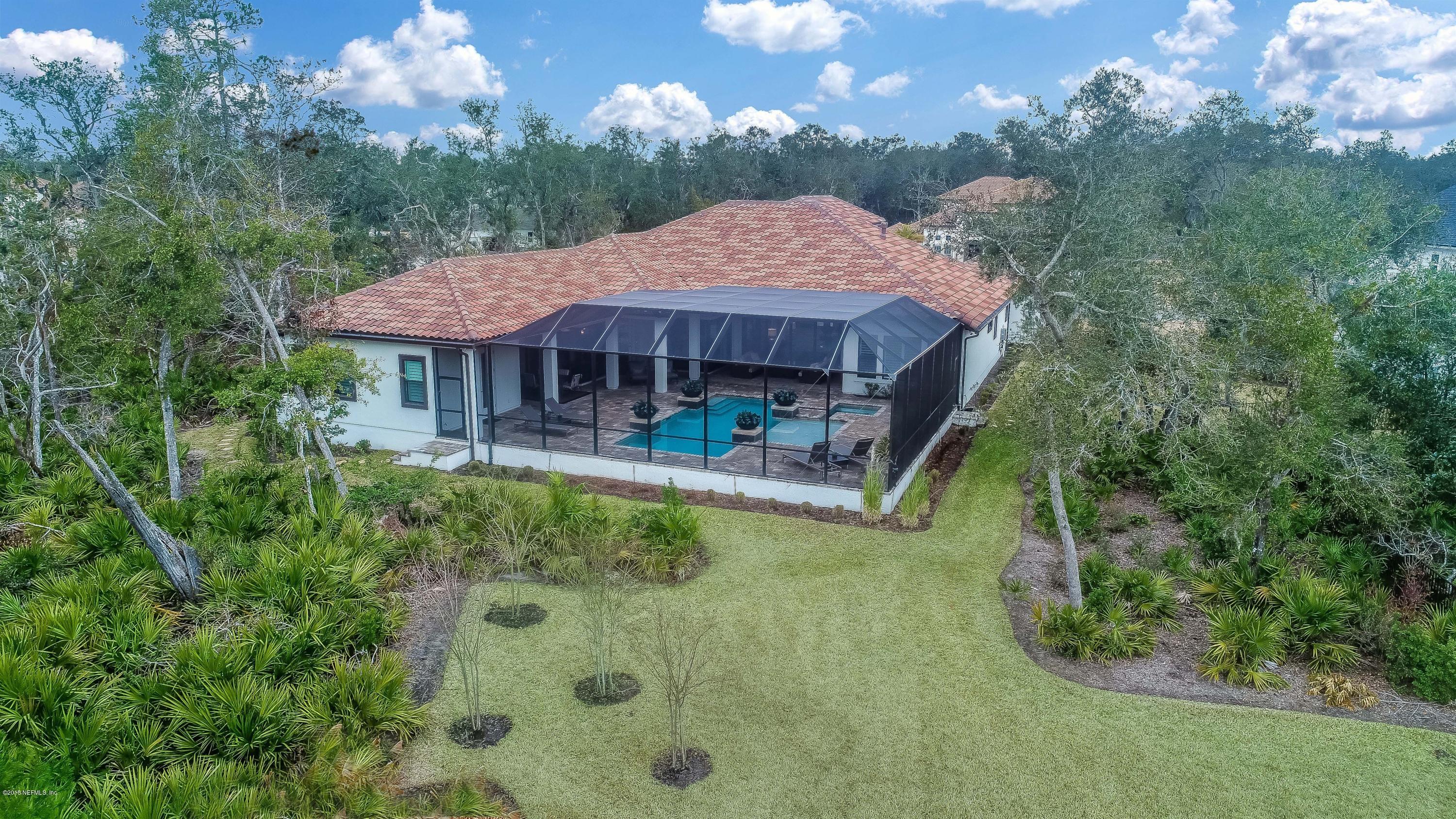 68 Costa Del Sol Drive St. Augustine, FL 32095 - Photo 38 of 55 a view of a house with swimming pool next to a yard