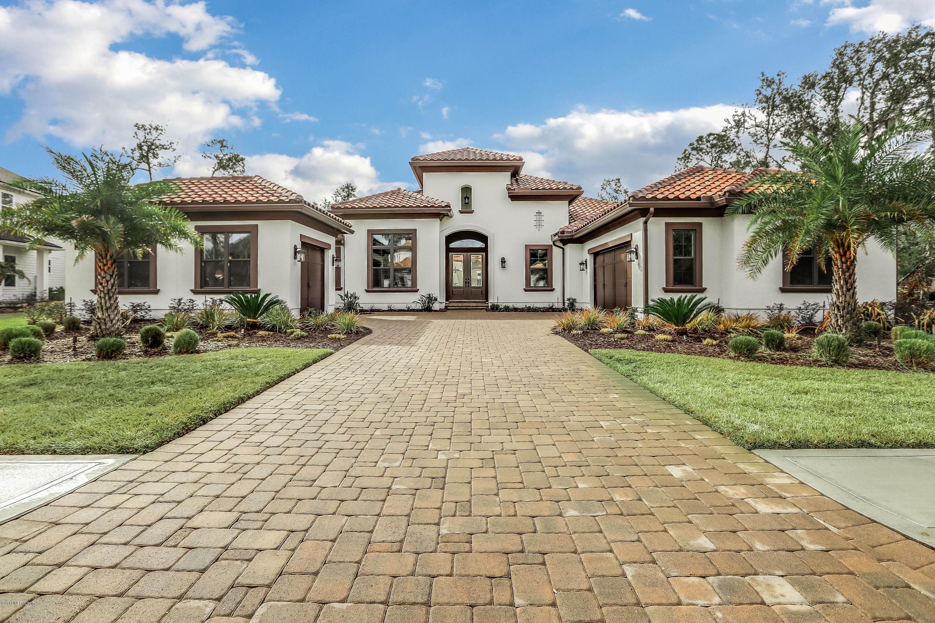 68 Costa Del Sol Drive St. Augustine, FL 32095 - Photo 40 of 55 a front view of a house with a yard and potted plants