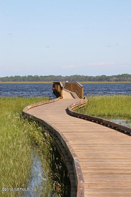 68 Costa Del Sol Drive St. Augustine, FL 32095 - Photo 51 of 55 a view of a lake with a terrace