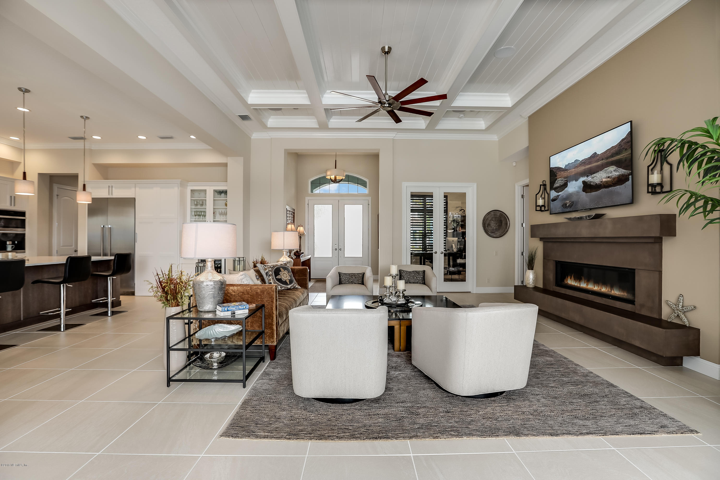 68 Costa Del Sol Drive St. Augustine, FL 32095 - Photo 6 of 55 a living room with furniture a fireplace and a table