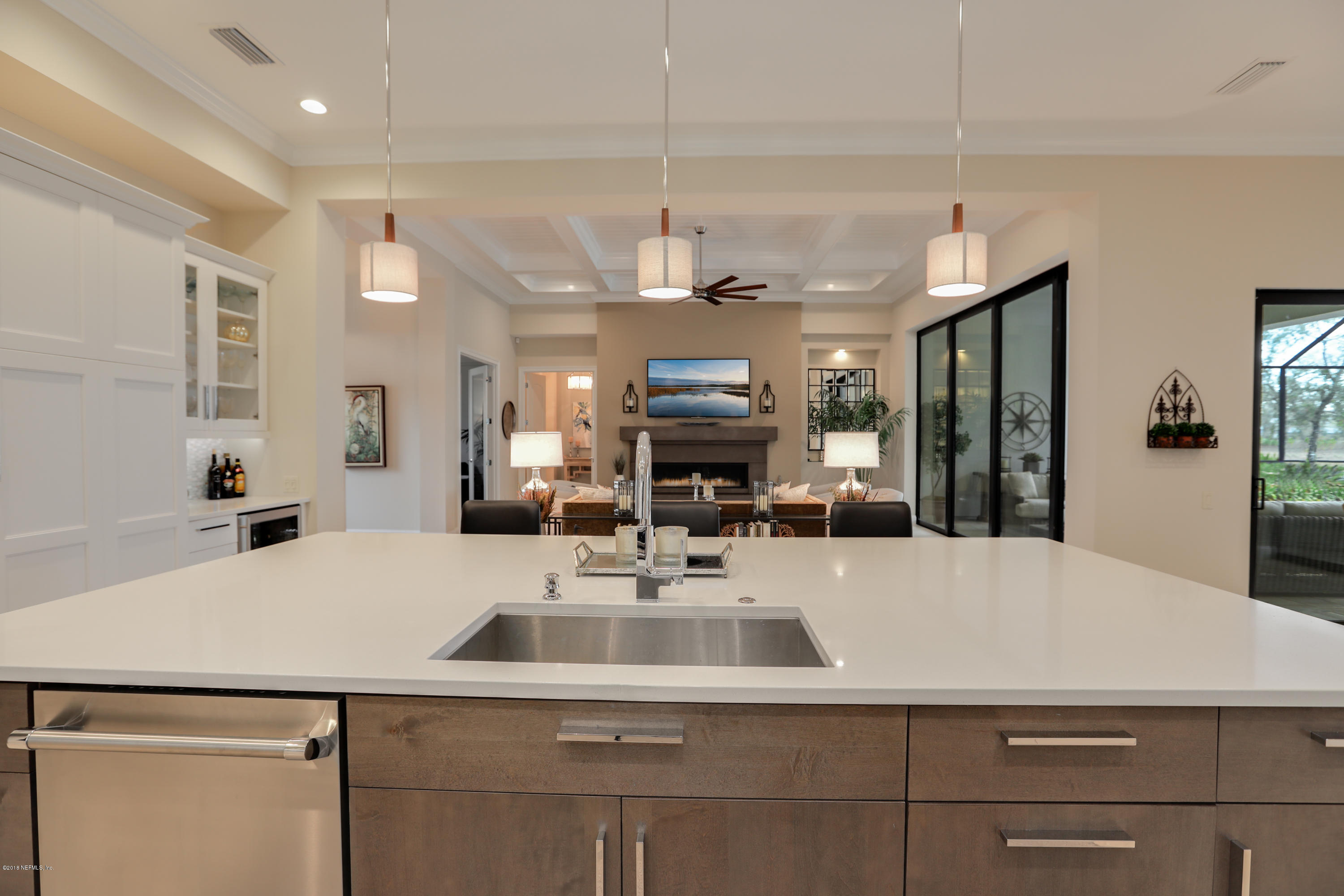 68 Costa Del Sol Drive St. Augustine, FL 32095 - Photo 10 of 55 a kitchen with a sink a counter and cabinets